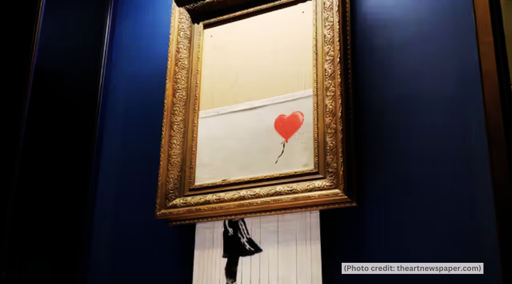 banksy girl with balloon partially shredded